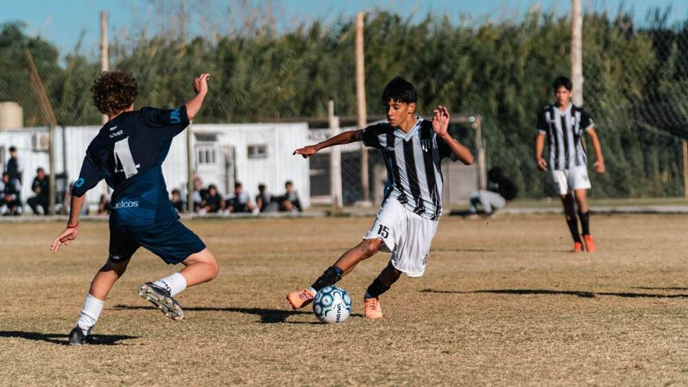 Lincoln soccer player dribbling the ball during a game